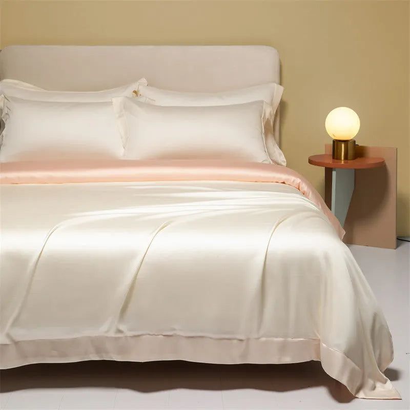 Solid colour Tencel Lyocell bed linen set with quilt cover and pillowcases on a bed.