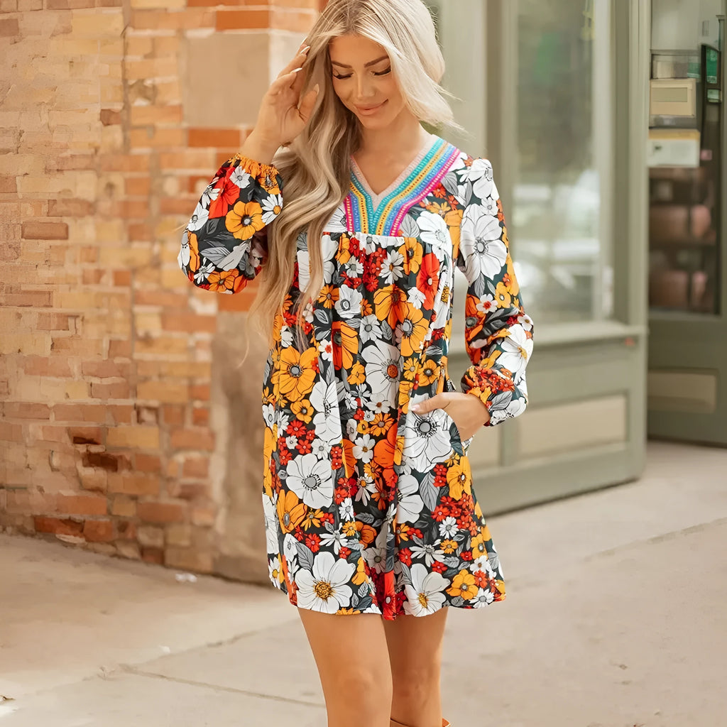 Orange floral striped lace V-neck long sleeve mini dress on hanger