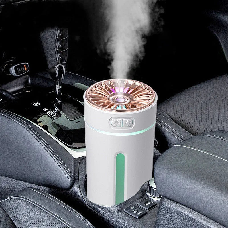 Black portable car humidifier with colourful LED lights on car cup holder showing mist output