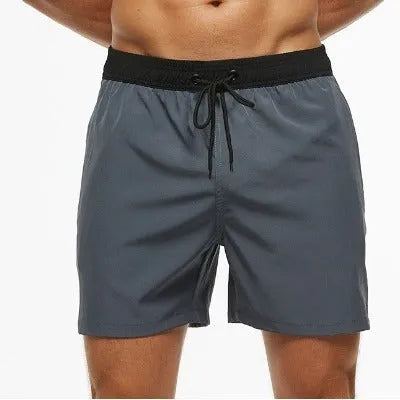 Men's blue polyester running shorts with a drawstring waist and a side headband pocket.
