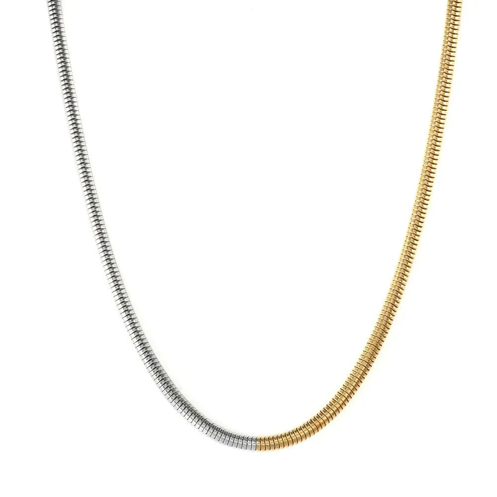 Women's stainless steel snake bone chain necklace with gold finish and geometric line detailing
