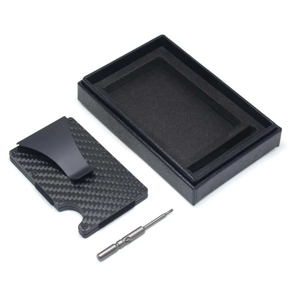 Geometrical black carbon fibre card wallet for business cards and banknotes on a gift box.