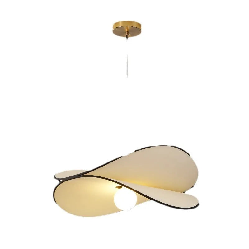French artistic modern fabric potato chips chandelier pendant light in a bedroom setting.