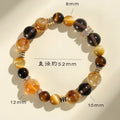 Natural yellow tower crystal string beads bracelet with 10mm Jinba design on wrist