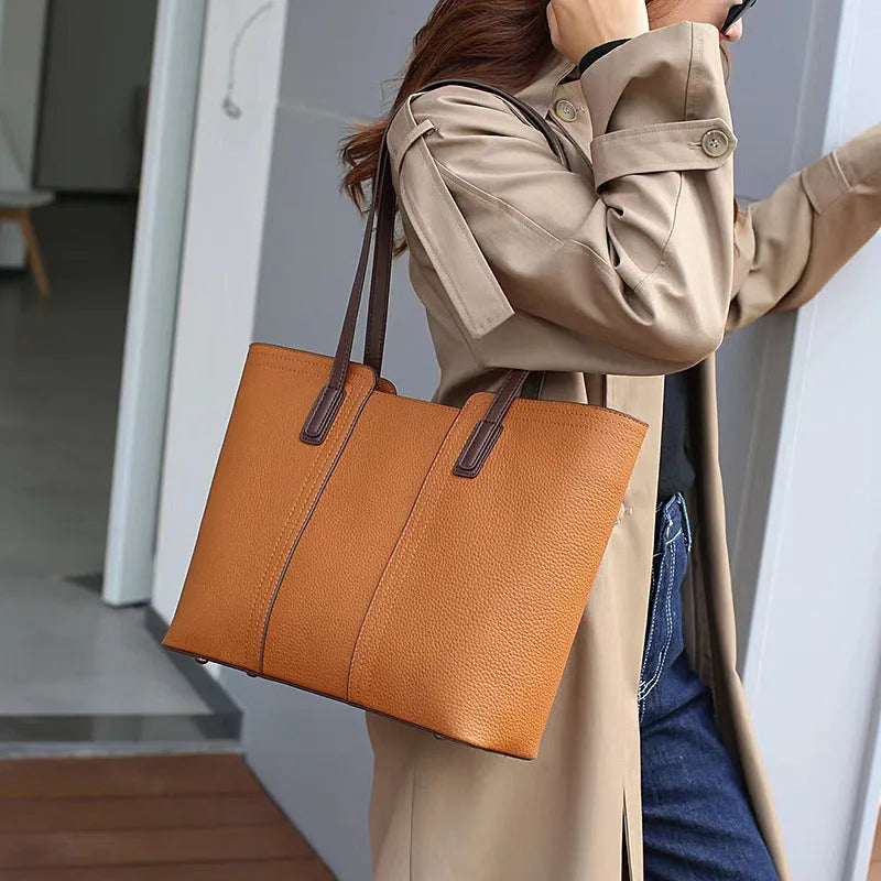 Women's black genuine leather crossbody shoulder bag with horizontal square shape and multiple internal compartments