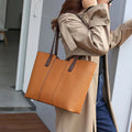 Women's black genuine leather crossbody shoulder bag with horizontal square shape and multiple internal compartments