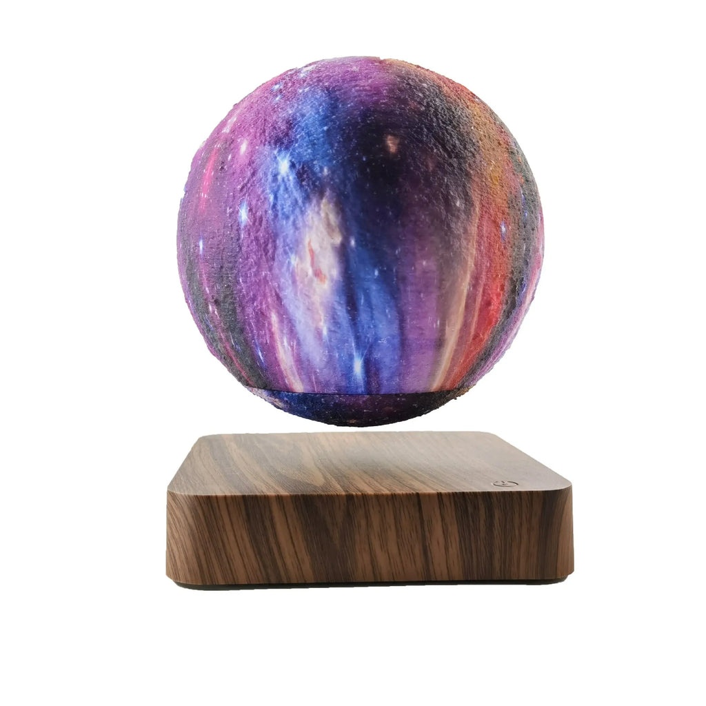 Levitating galaxy moon lamp floating above walnut colour base with starry light pattern