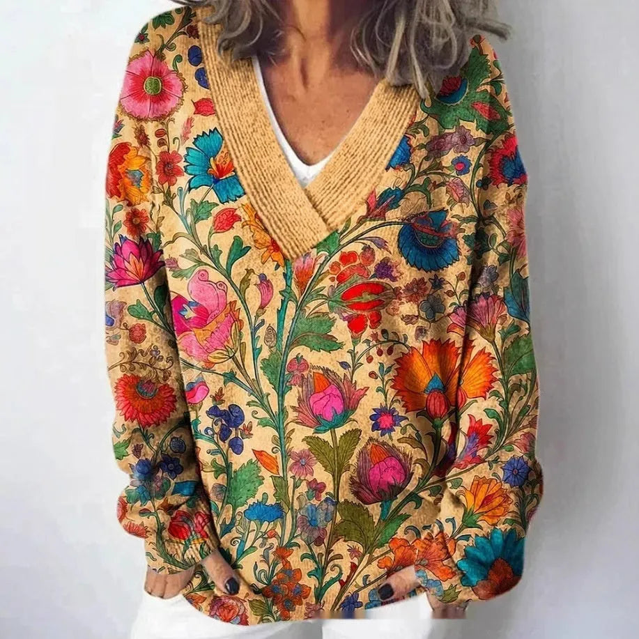 Women's V-neck sweatshirt with a white background and a textured 3D floral printed pattern.