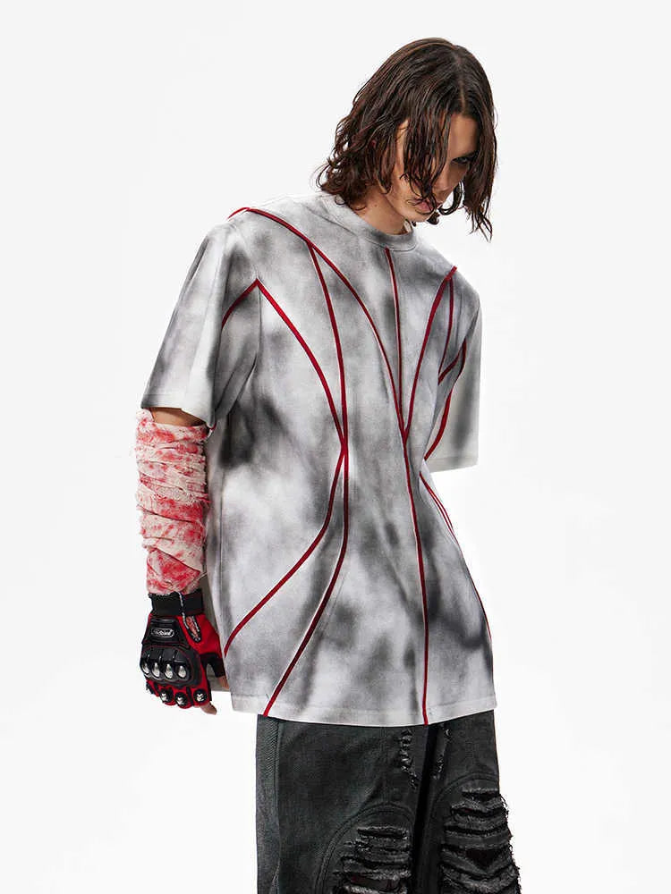 Women's light grey T-shirt with padded shoulders and textured white line patchwork detail on the front.
