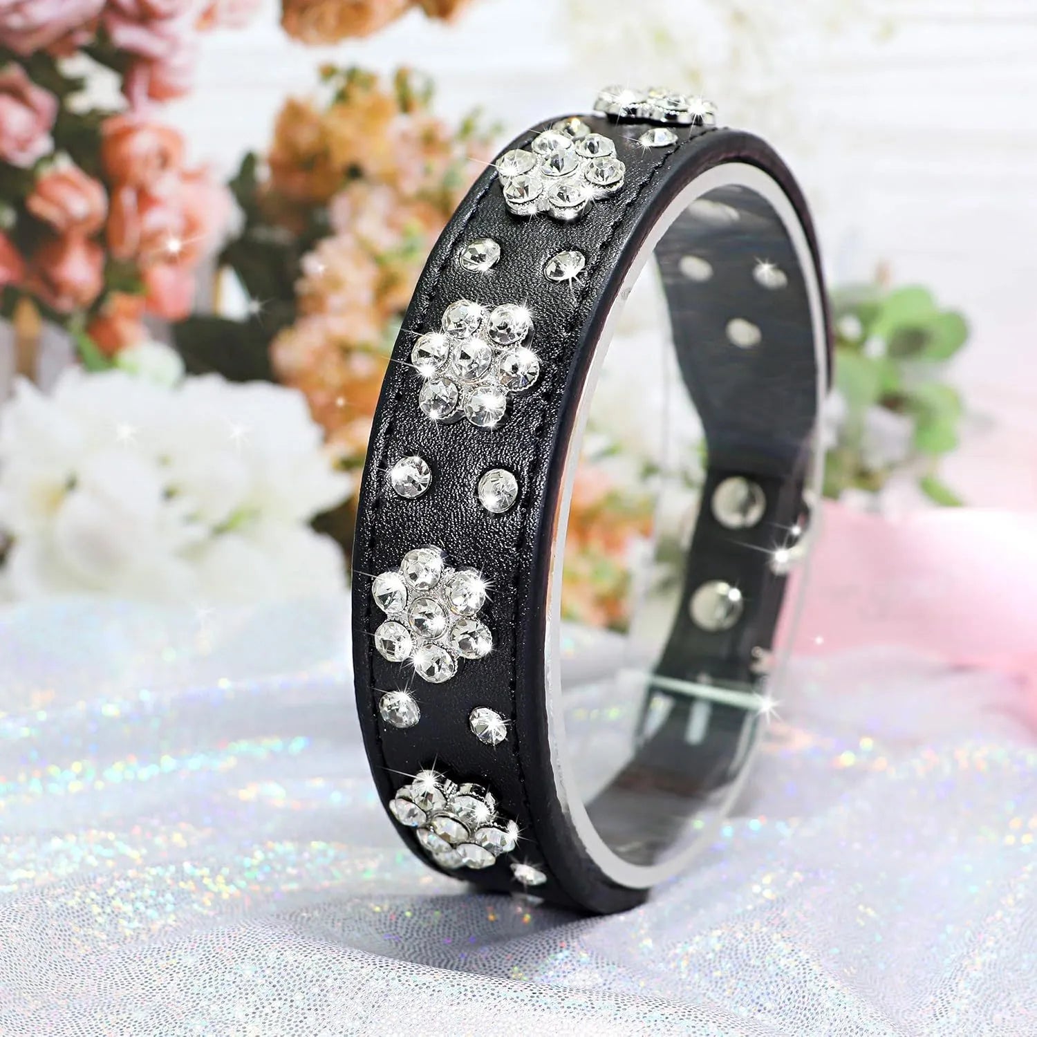 Rhinestone flower pattern on a black adjustable PU leather dog collar with metal D-ring for small dogs.