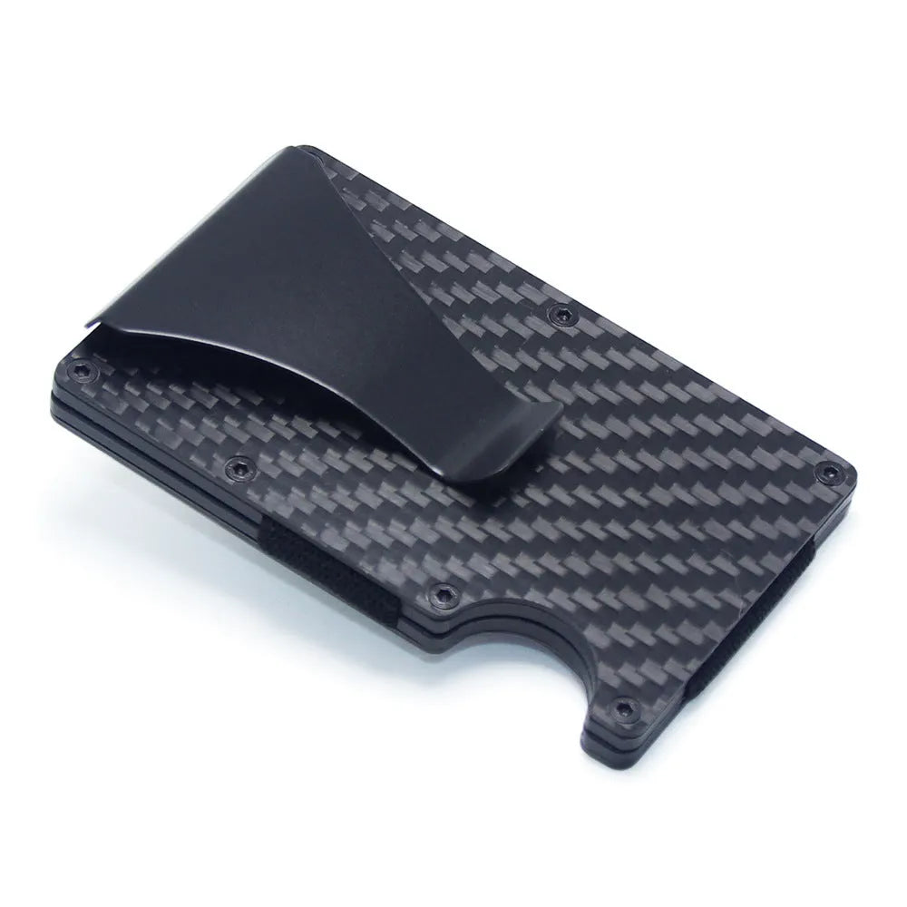 Geometrical black carbon fibre card wallet for business cards and banknotes on a gift box.