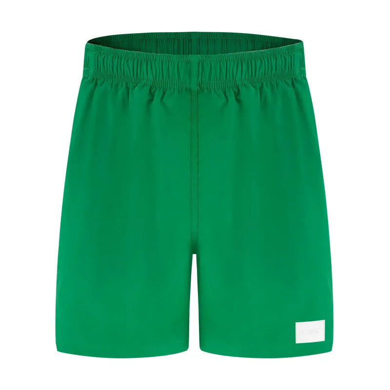 Men's solid colour quick-drying nylon beach shorts in a straight-leg style on a mannequin.