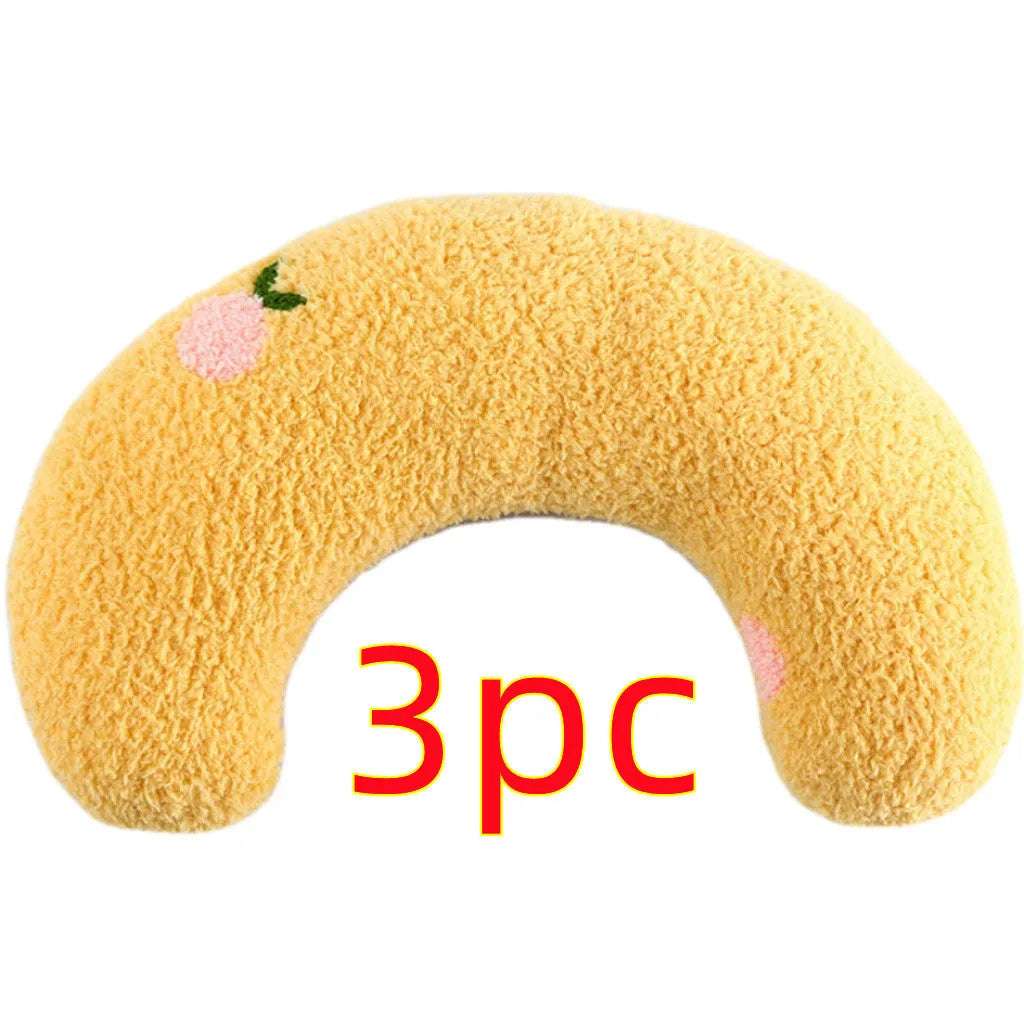 Plush U-shaped pet pillow for small cats and dogs in blue, showing quilted faux fur texture.