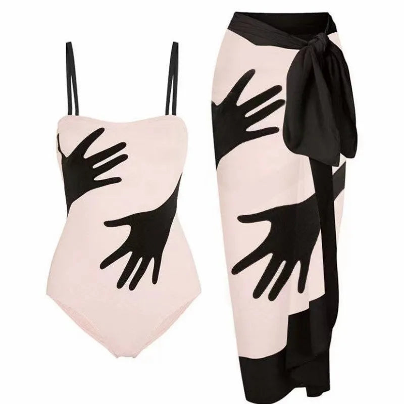 Women's one-piece swimsuit bikini with a sheer gauze skirt overlay.
