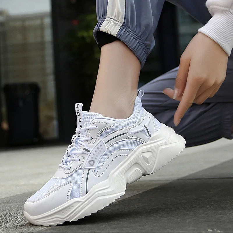 White women's casual sports shoes with mesh upper, thick PU sole, and lace closure.