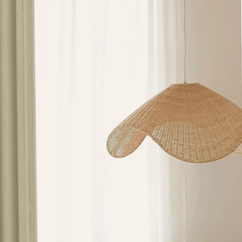 Handwoven natural rattan and willow bamboo chandelier with warm white LED light in three size diameters.