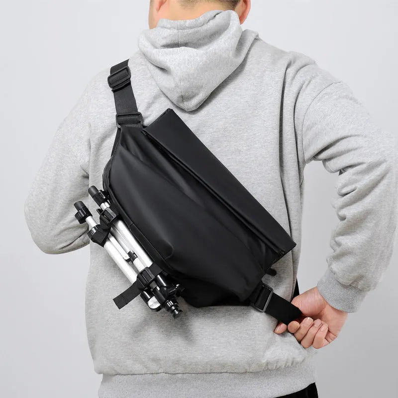 Grey medium crossbody bag with zipper opening showing internal phone and document compartments