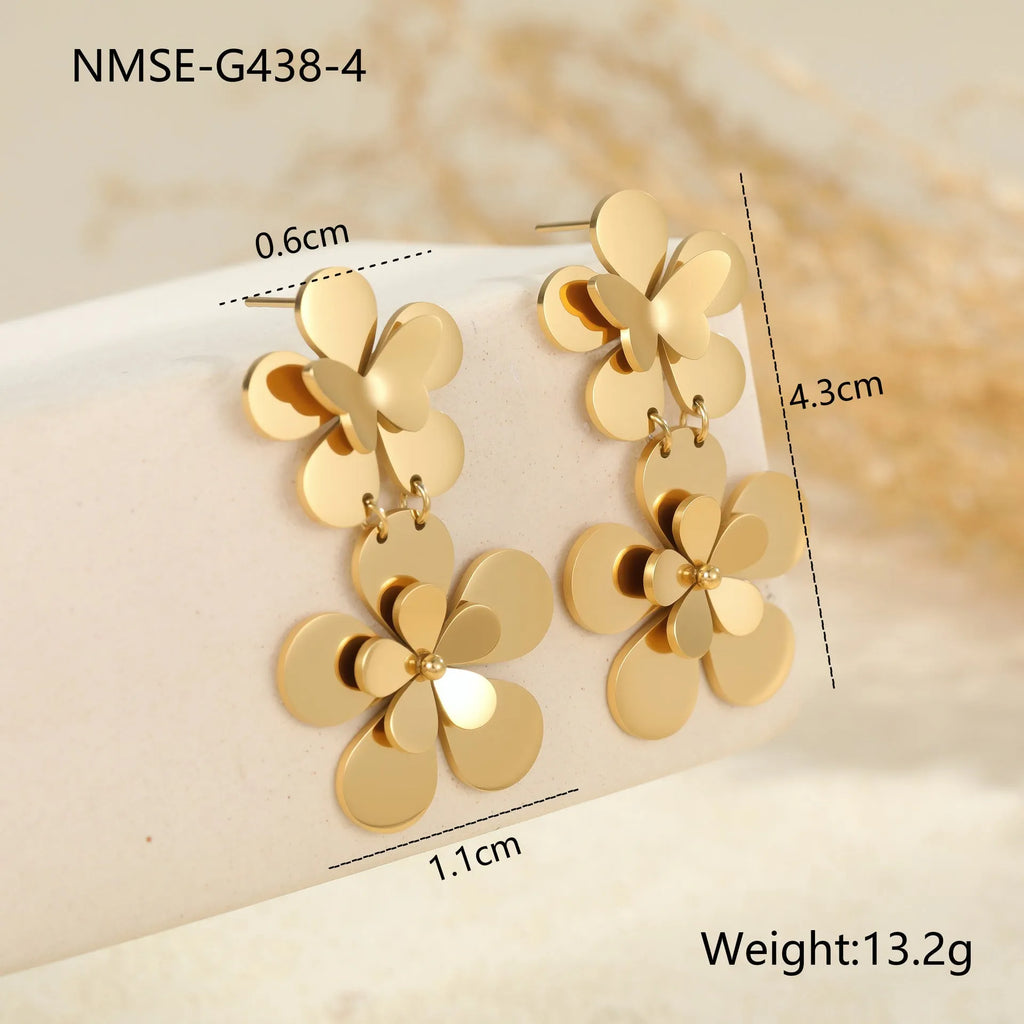Gold flower butterfly stainless steel earrings with geometric and zodiac design elements