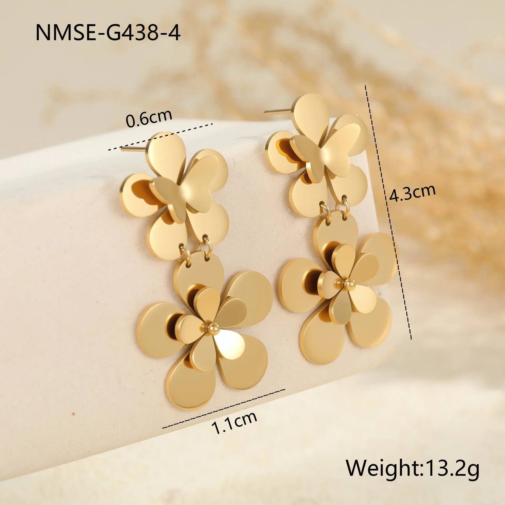 Gold flower butterfly stainless steel earrings with geometric and zodiac design elements