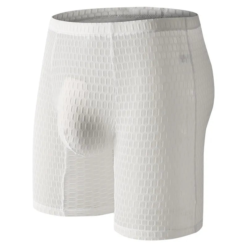 Men's lace boxer underwear in a lengthened hip lifting design on a solid colour background.
