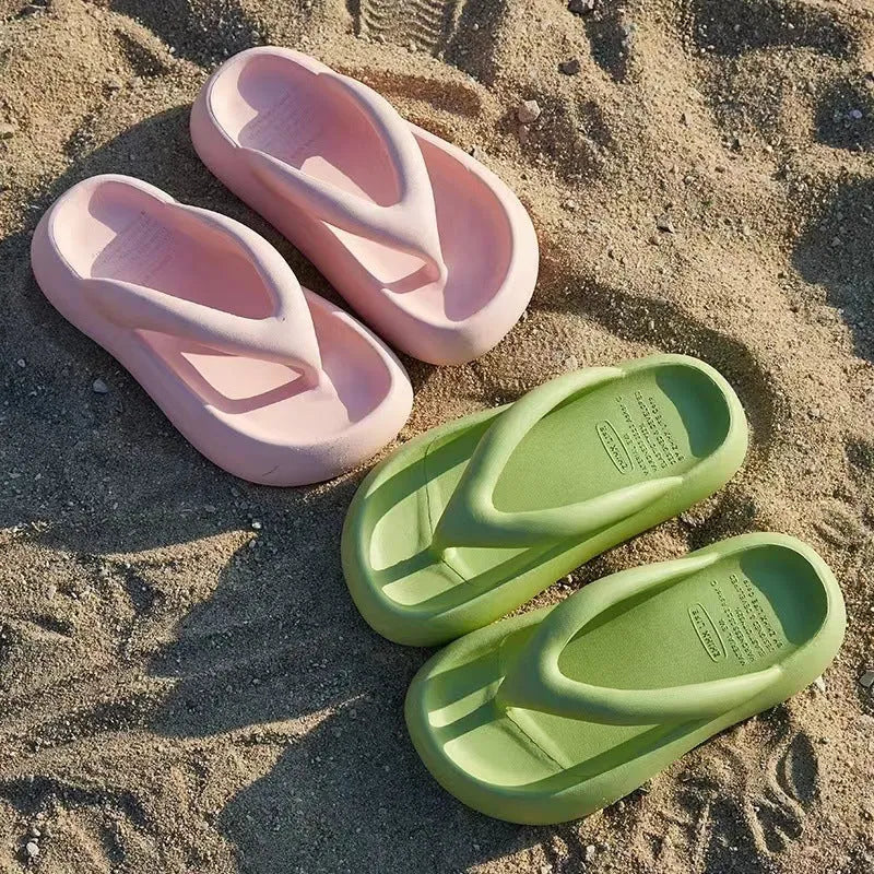 Solid colour EVA flip flops with a thick platform sole and a decorative bow on the strap.