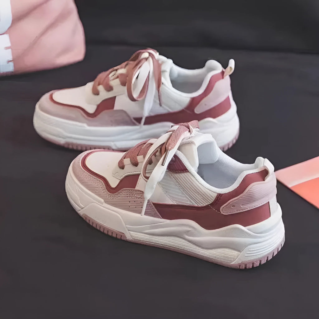 Low-top sneakers with rubber soles in beige and pink colour options showing height-increasing design