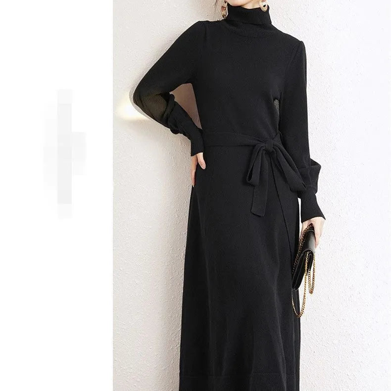 Rose red knitted turtleneck pullover dress with long sleeves and a loose, mid-length skirt with an elasticated waist.