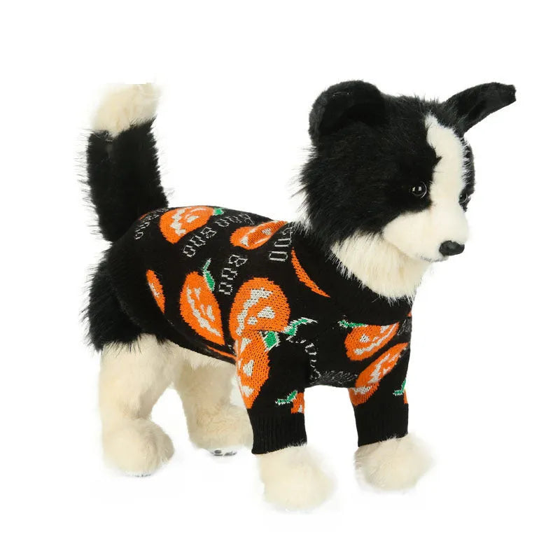 Black dog sweater with an orange Halloween pumpkin print on the back.