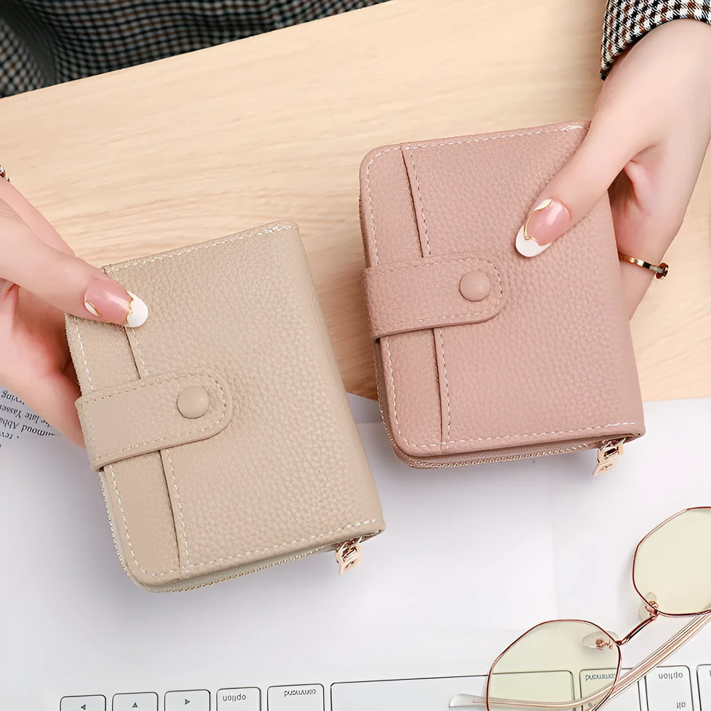 Women's Lychee pattern organ short wallet in breathable antibacterial PU, shown in beige, pink, black, and red colour options.