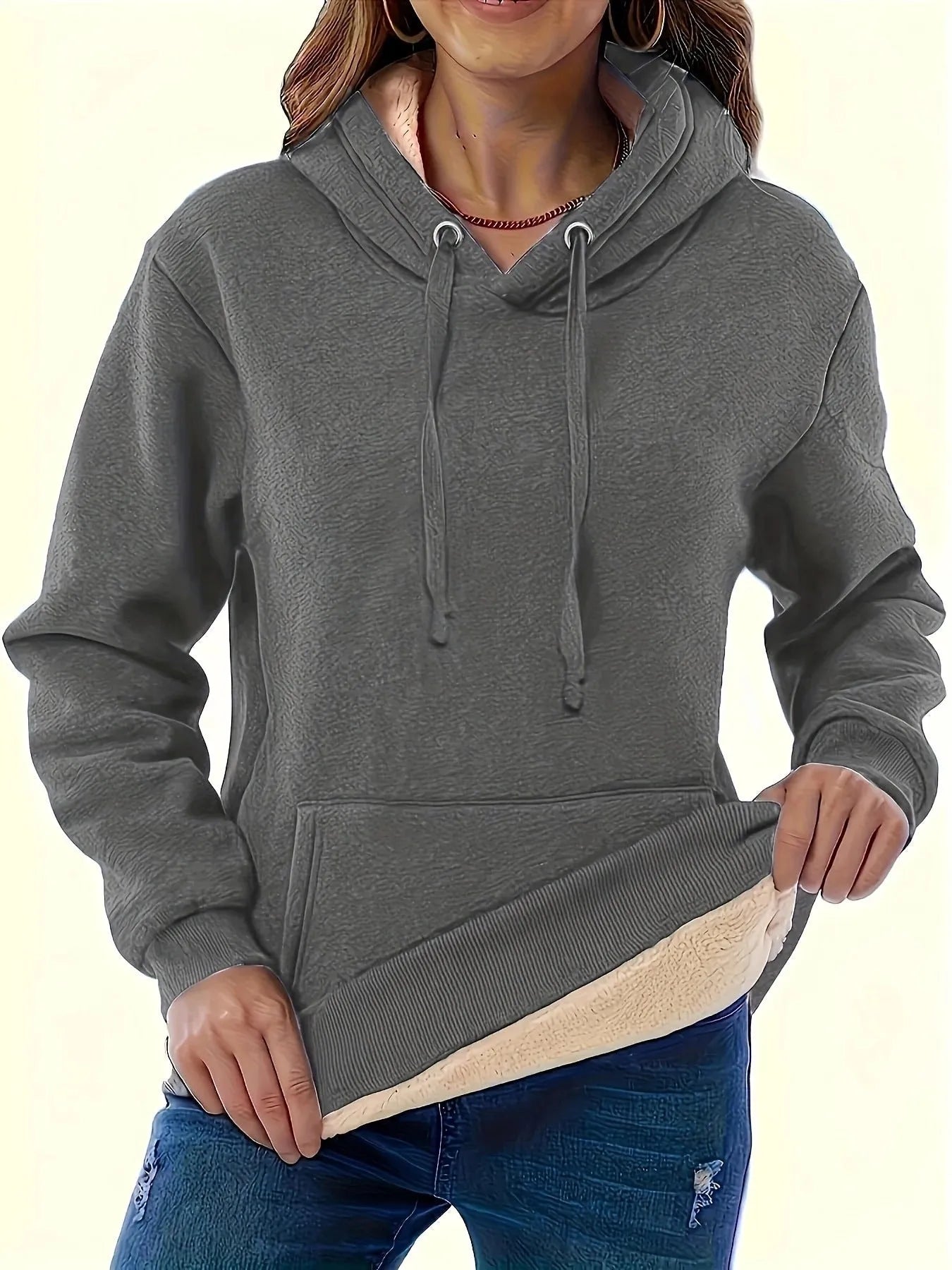 A woman's loose-fit hooded sweater with a raised 3D pattern, shown in a wine red colour.