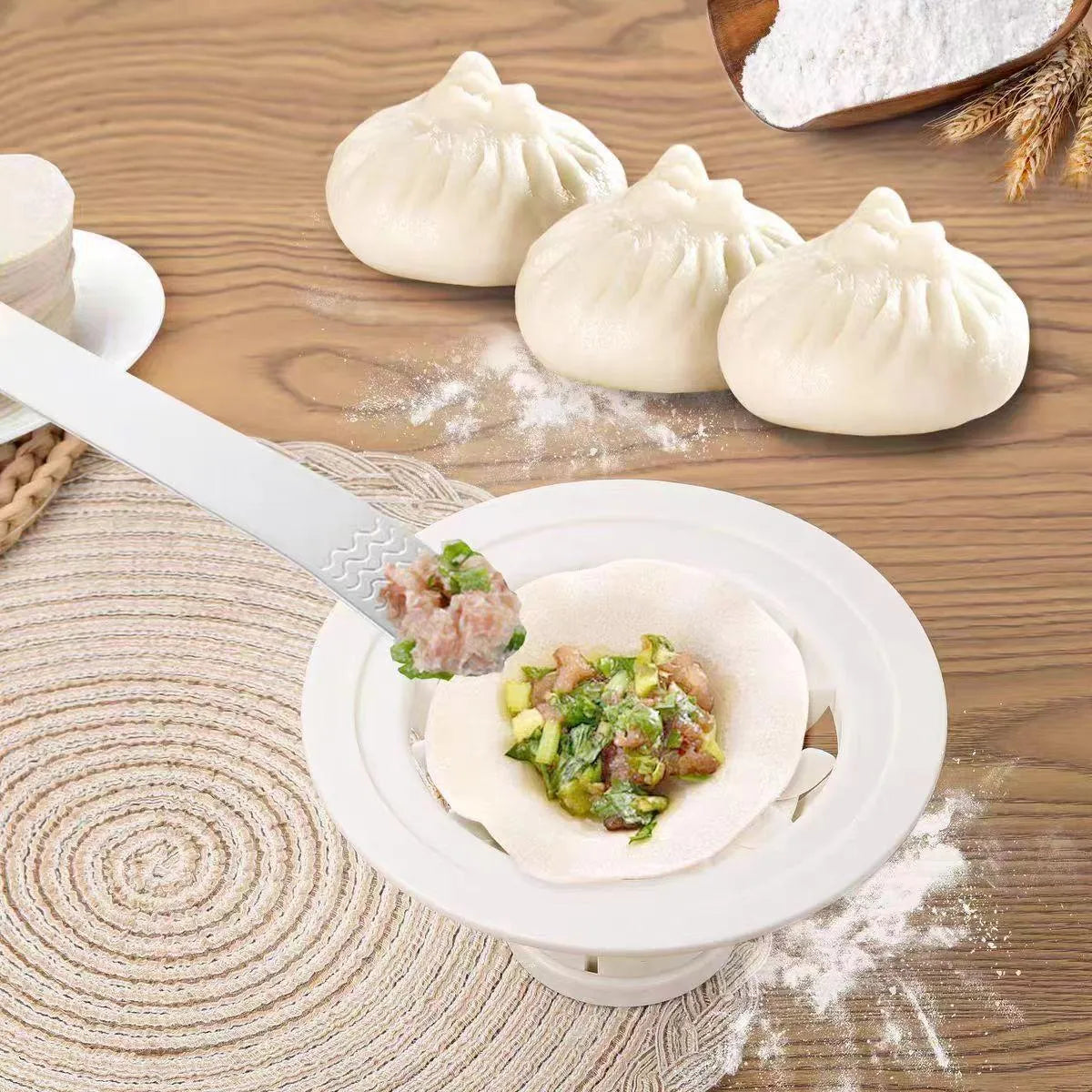 Four black steamed bun moulds for shaping baozi and dumplings