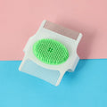 Multifunctional pet grooming comb with floating hair removal and massage functions in blue or green colour