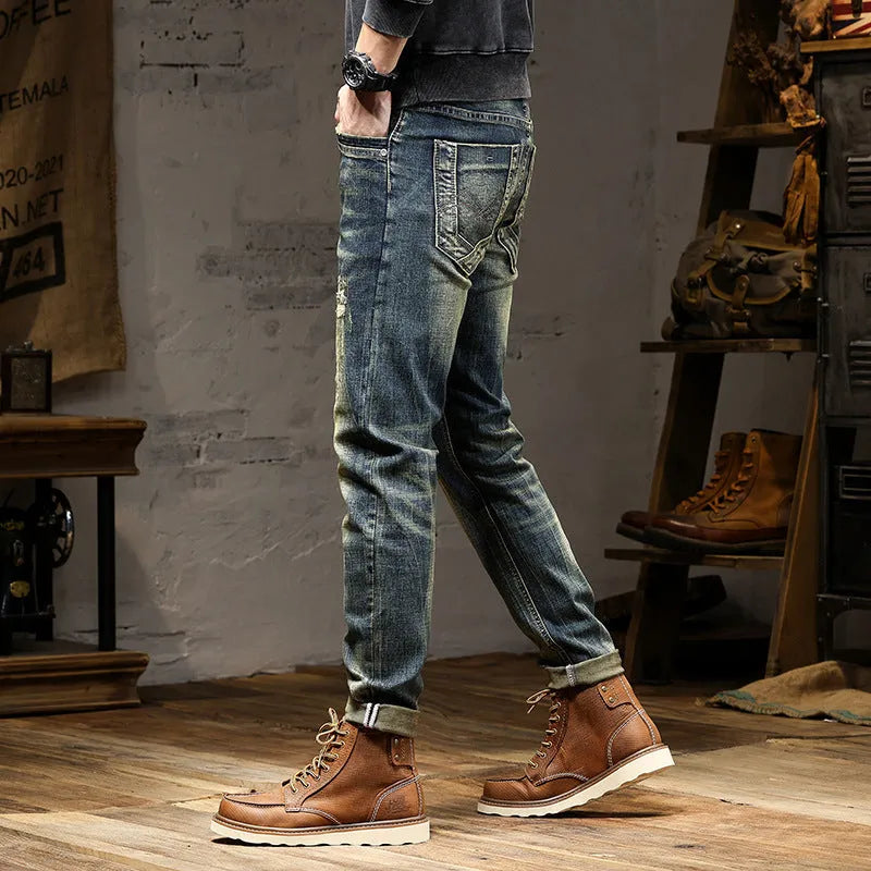 Man wearing retro blue skinny fit stretch denim jeans with a zip fly.