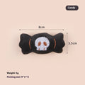 Small plush cat teaser wand with three interchangeable attachments: candy, eyes and skull designs