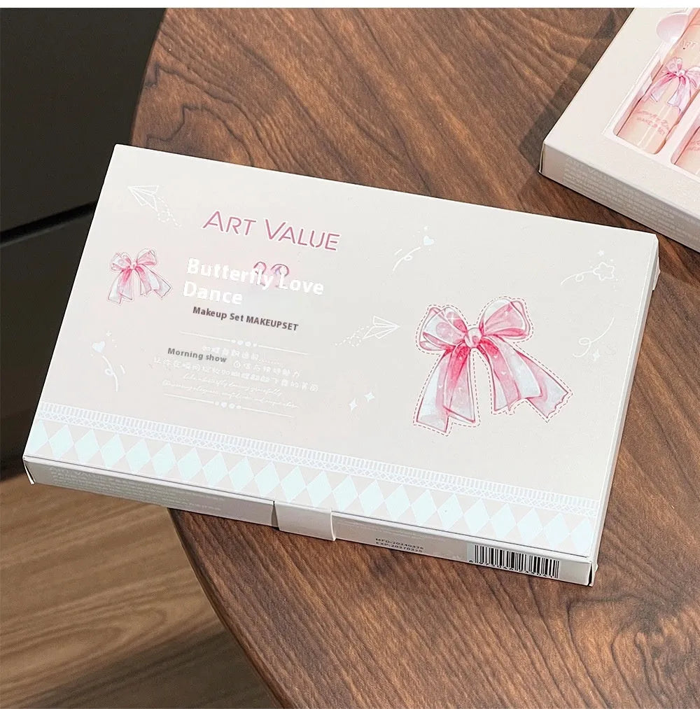 Butterfly Box makeup set showing four matte lip mud pots, powder blusher compact, and decorative necklace