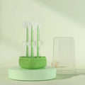 Blue, green, and purple silicone pet toothbrushes for dog and cat dental cleaning.