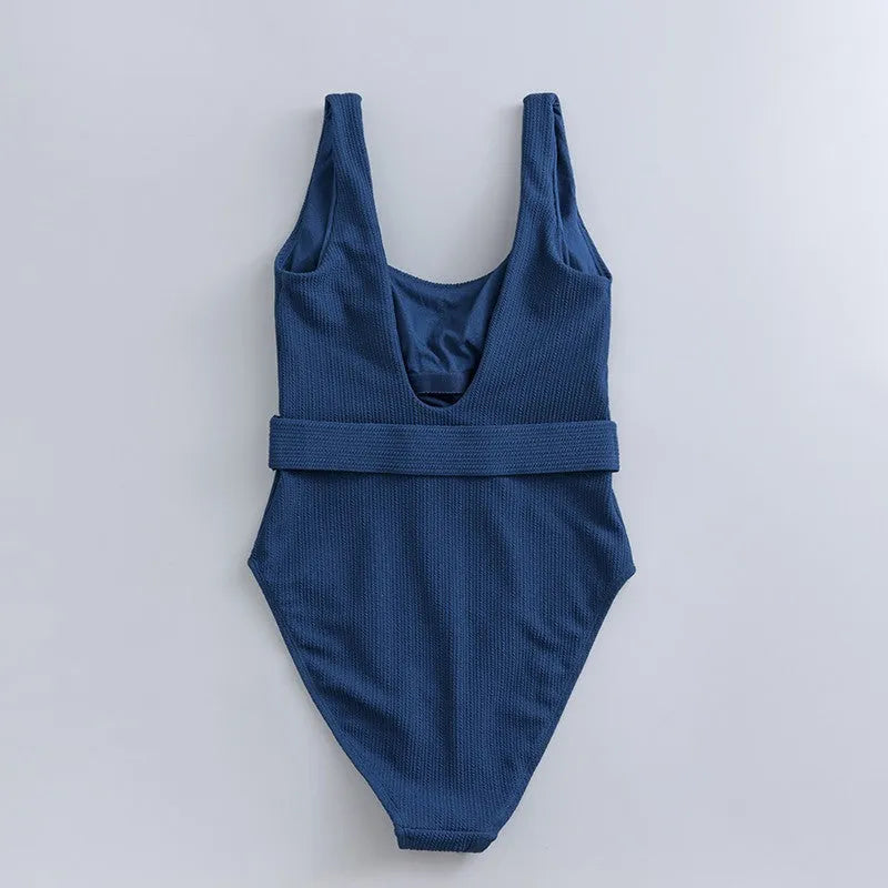 Navy blue women's one-piece swimsuit with triangle slimming design and chest pad support