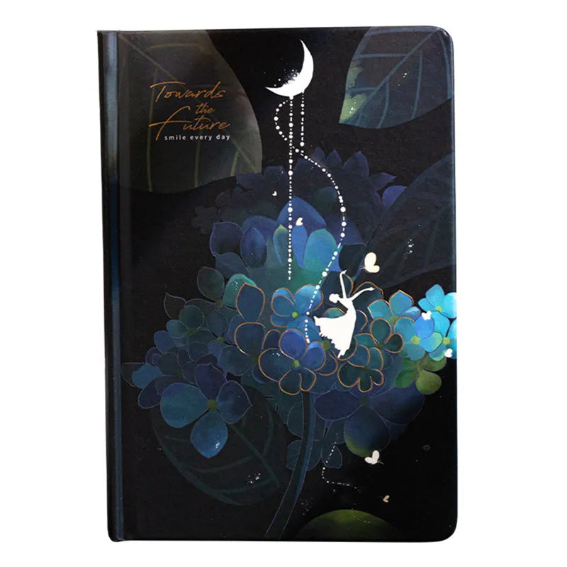 A5 notebook with luminous cover open to show an internal colour illustration, in deep blue colour.