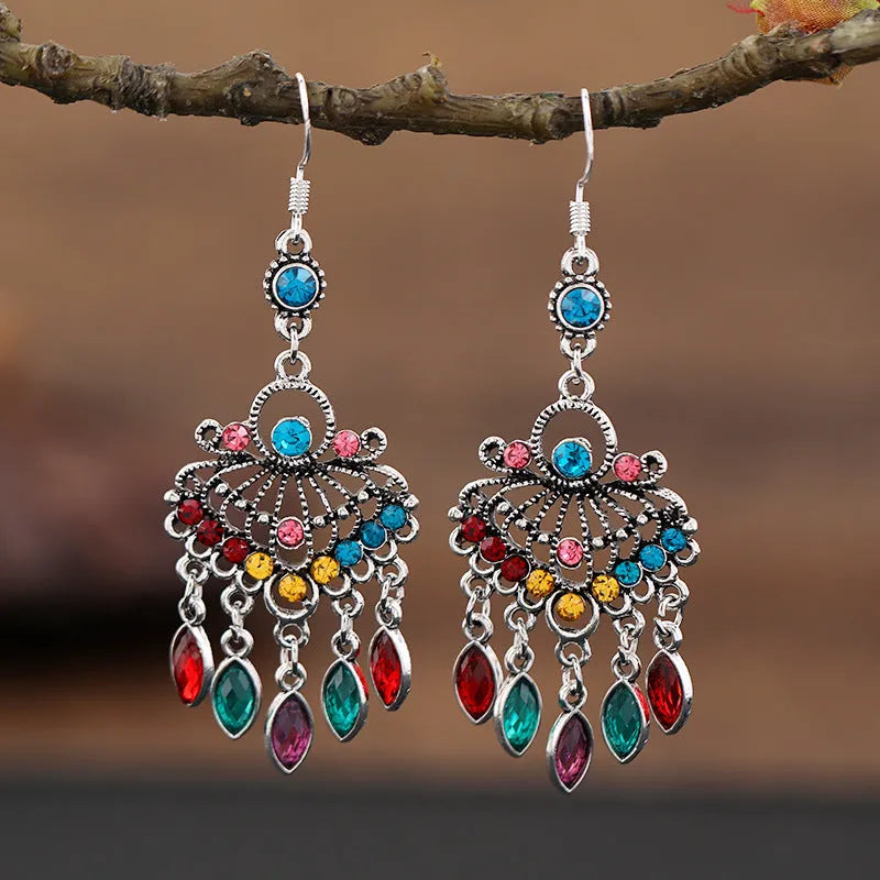 Pair of long purple drop shape fringe earrings with crystals in a retro ethnic style.