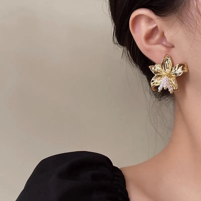 Golden flower earrings with pearl designs and exaggerated floral shape for women