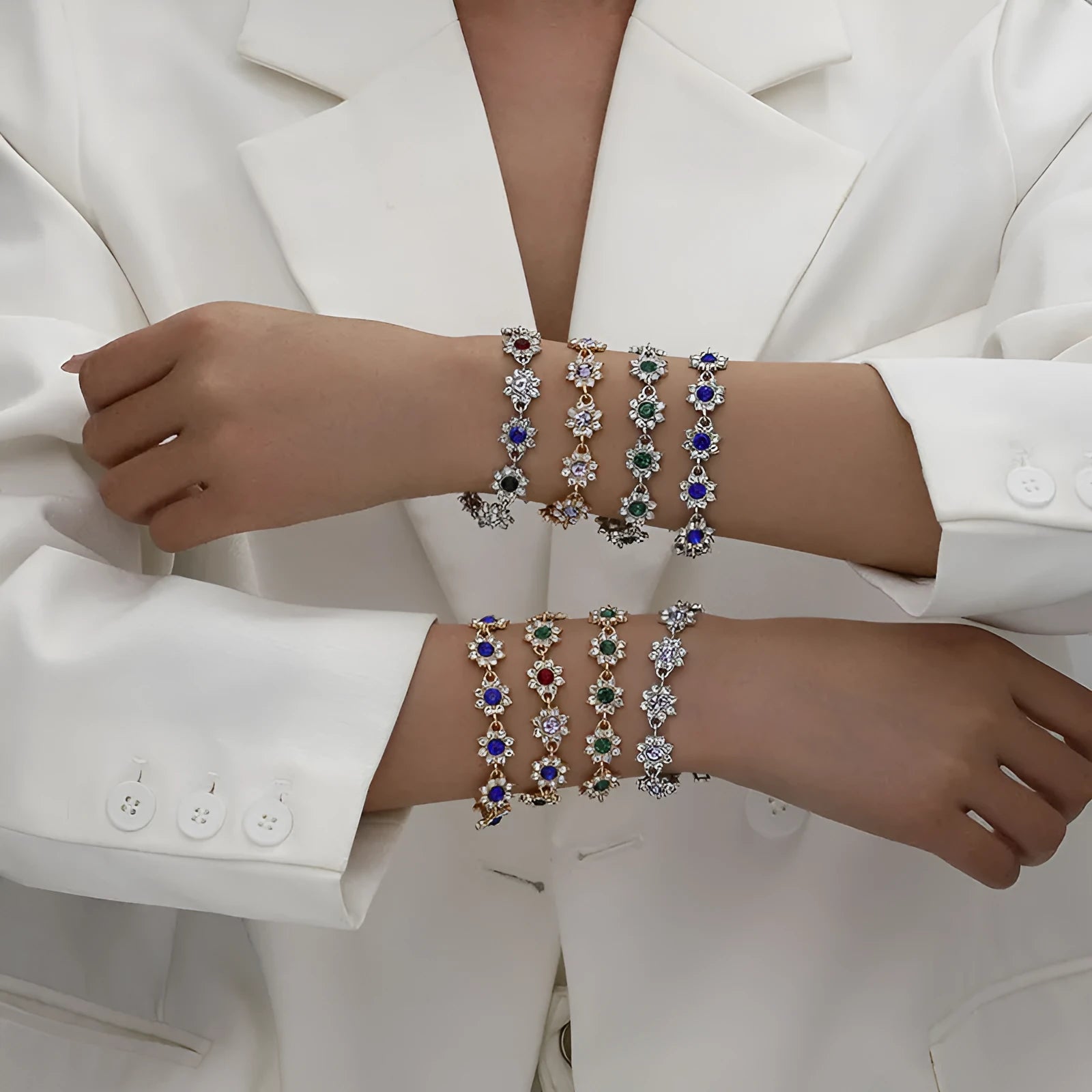 Gold and silver tone zinc alloy flower bracelet with electroplated coloured gemstones including crystal and diamond accents.