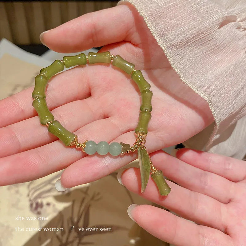 Chinese style glass bracelet with bamboo joint element in multiple colour variations