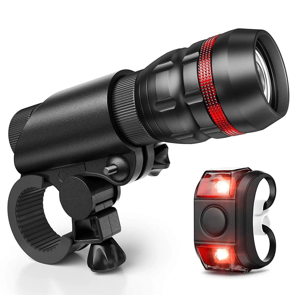 Bicycle headlight and taillight set with a black mounting bracket on a handlebar