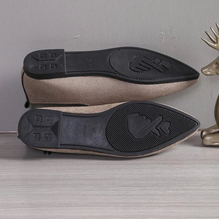 Beige leopard print women's pumps with a pointed toe, shown in a plus size.