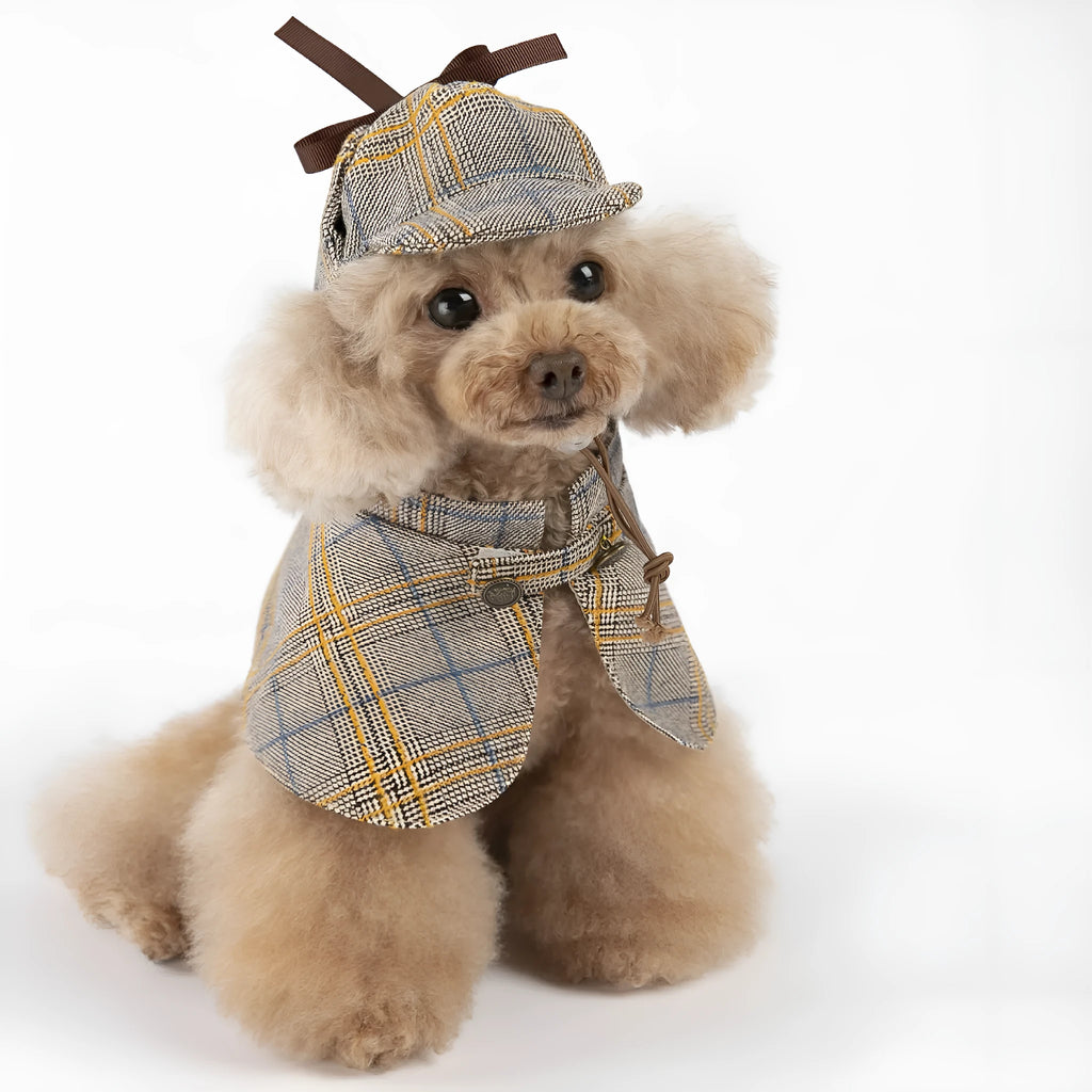Camel-coloured cotton pet cloak with an adjustable hat shown on a model dog.