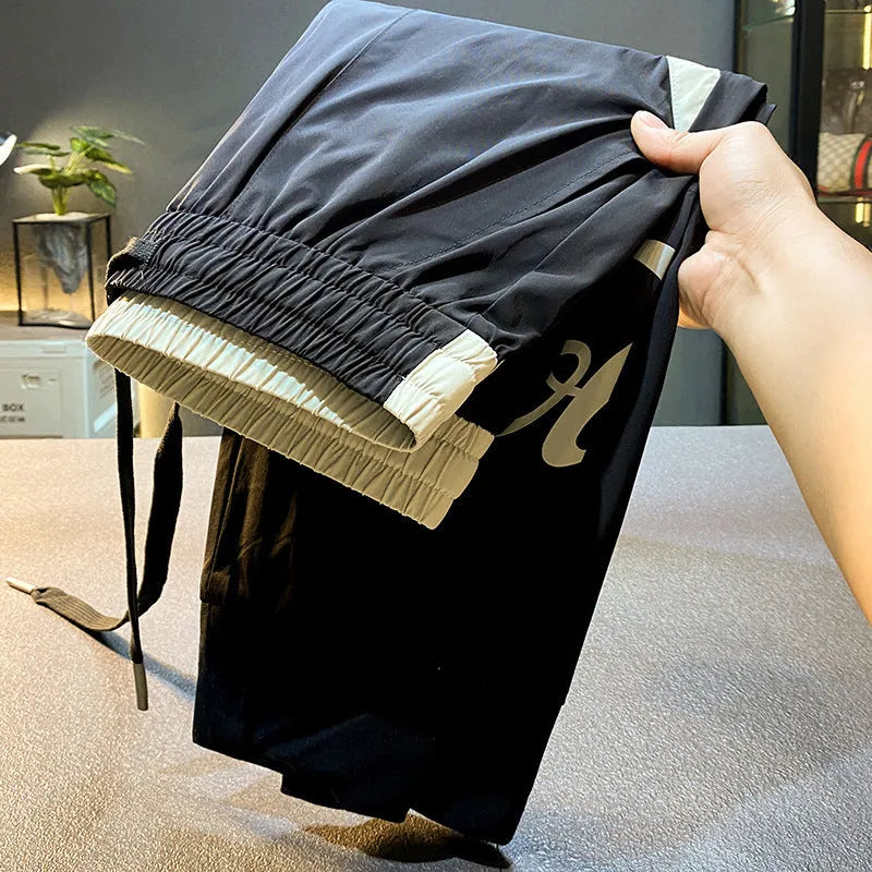 Men's solid black ultra-thin ice silk ankle banded cropped casual trousers