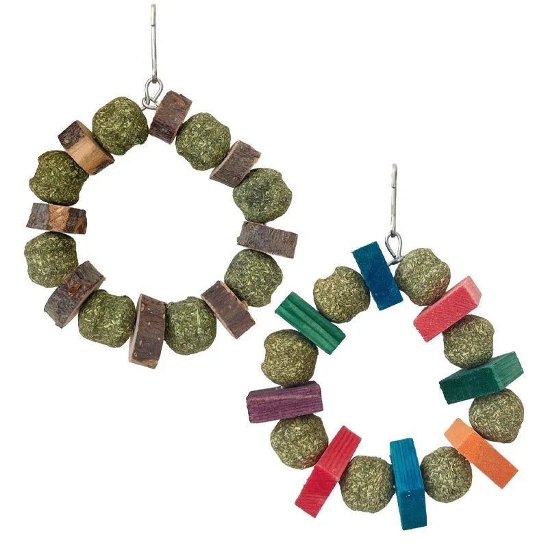 Hamster toy with applewood chew rod and decorative straw ball rings for small animal enrichment