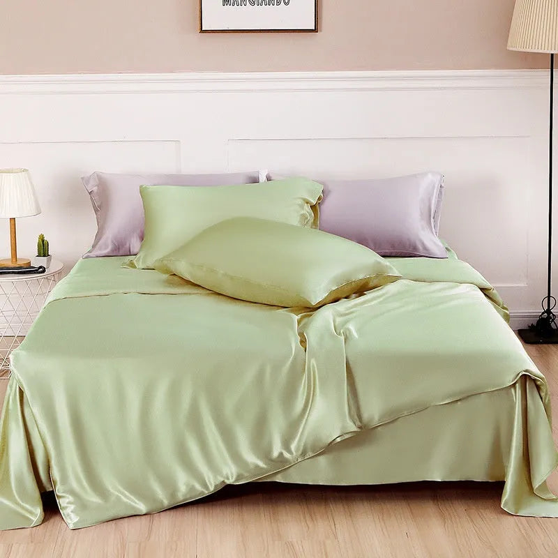 Pure silk duvet cover in a solid colour showing its sheen and texture, laid flat on a bed.