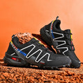 Men's grey orange plus size casual running shoes with low-top design on a plain background.