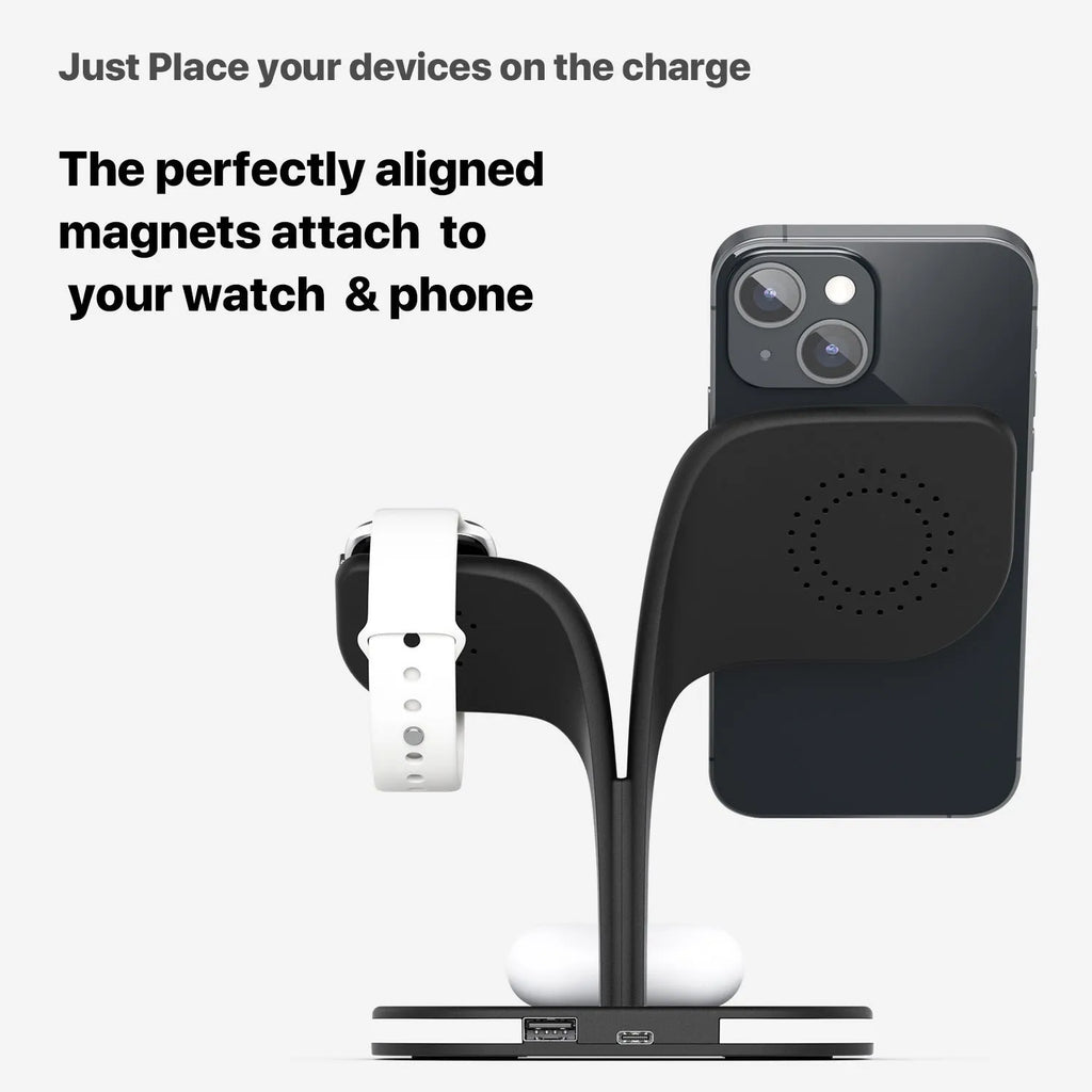 Black wireless charging stand holding a phone, a smartwatch, and wireless earbuds on a desk.